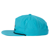 Bright turquoise baseball cap with perforated design on the crown.