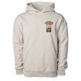 Cream-colored hooded sweatshirt with a small graphic design on the chest.