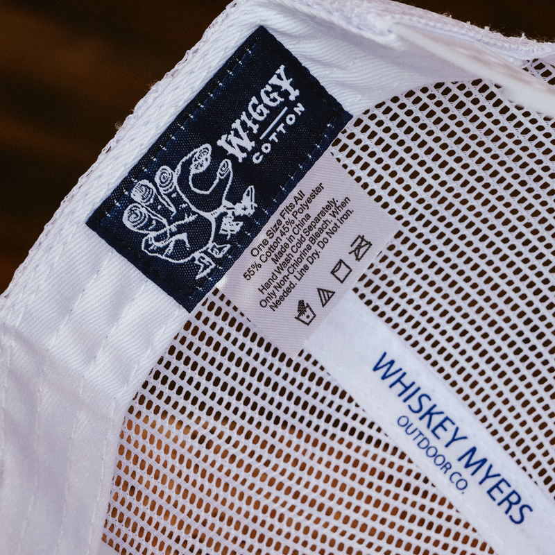 Clothing label showing brand ’Big Swiggy Cotton’ and care instructions.