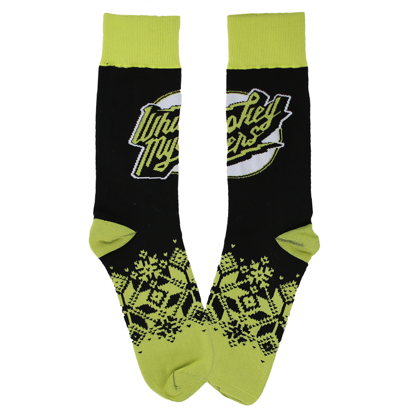 Pair of black and neon green socks with a logo and snowflake pattern.