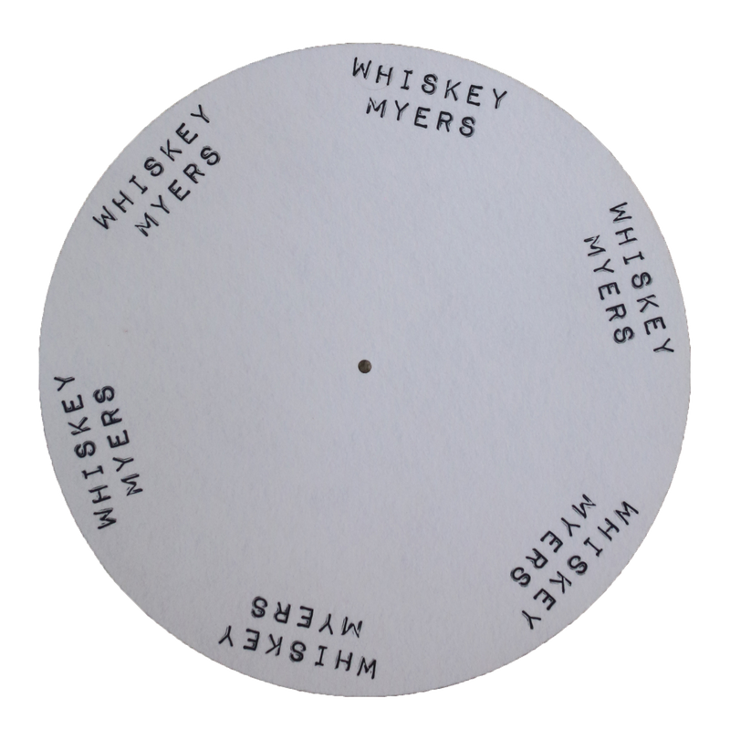 Circular gray disc with ’WHISKEY MYERS’ text repeated around its edge.